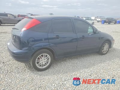Trzecie zdjęcie samochodu z tyłu: 2003 FORD FOCUS VIN:3FAHP37333R106016 - miniatura