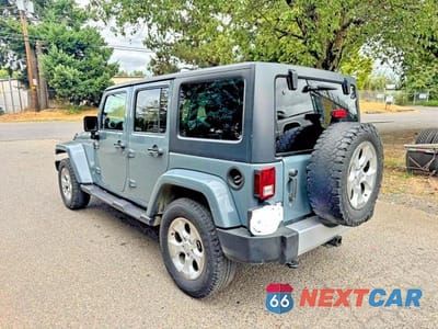 Trzecie zdjęcie samochodu z tyłu: 2014 JEEP WRANGLER UNLIMITED SAHARA VIN:1C4BJWEG1EL304085 - miniatura