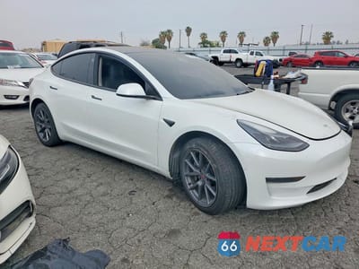 Czwarte zdjęcie samochodu z boku: 2022 TESLA MODEL 3 VIN:5YJ3E1EA6NF109819 - miniatura