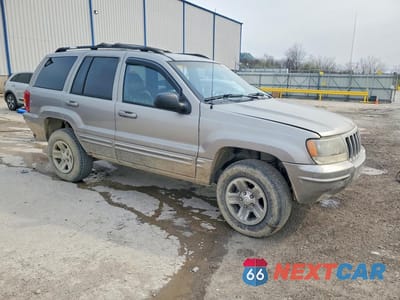 Czwarte zdjęcie samochodu z boku: 1999 JEEP GRAND CHEROKEE LIMITED VIN:1J4GW68N1XC671972 - miniatura