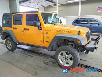 Czwarte zdjęcie samochodu z boku: 2012 JEEP WRANGLER UNLIMITED RUBICON VIN:1C4BJWFG3CL276852 - miniatura