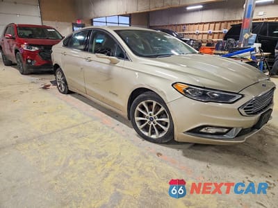 Czwarte zdjęcie samochodu z boku: 2017 FORD FUSION SE HYBRID VIN:3FA6P0LUXHR171912 - miniatura