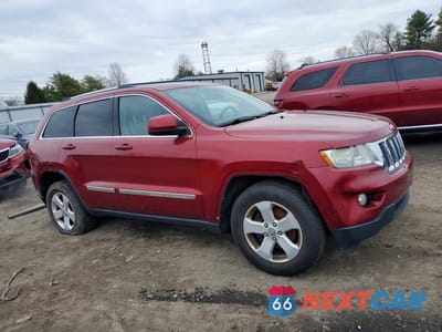 Czwarte zdjęcie samochodu z boku: 2013 JEEP GRAND CHEROKEE LAREDO VIN:1C4RJFAG1DC600064 - miniatura