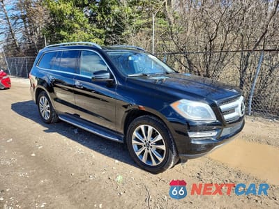 Czwarte zdjęcie samochodu z boku: 2014 MERCEDES-BENZ GL 450 4MATIC VIN:4JGDF7CEXEA334081 - miniatura