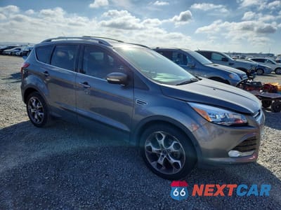 Czwarte zdjęcie samochodu z boku: 2014 FORD ESCAPE TITANIUM VIN:1FMCU0J97EUE13530 - miniatura