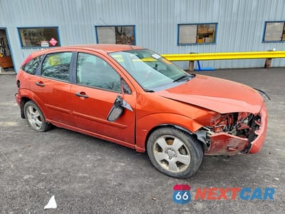 Czwarte zdjęcie samochodu z boku: 2005 FORD FOCUS ZX5 VIN:3FAHP37NX5R140796 - miniatura