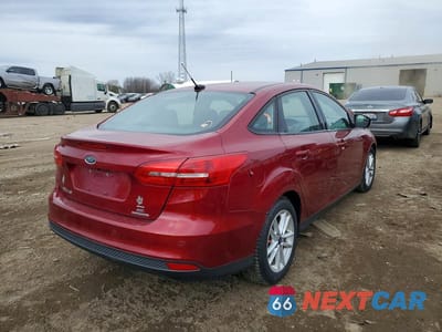 Trzecie zdjęcie samochodu z tyłu: 2016 FORD FOCUS SE VIN:1FADP3F27GL368925 - miniatura