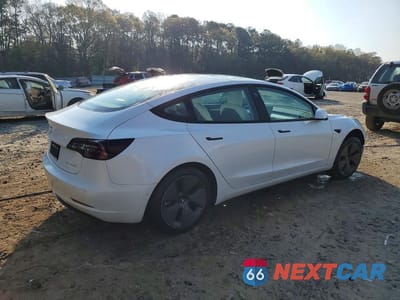 Trzecie zdjęcie samochodu z tyłu: 2022 TESLA MODEL 3 VIN:5YJ3E1EB3NF114324 - miniatura