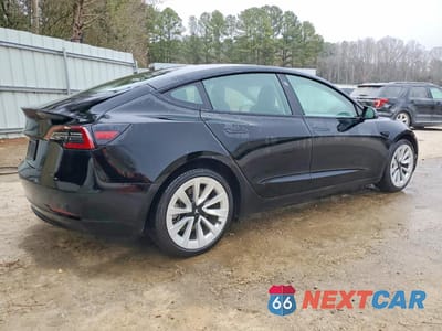 Trzecie zdjęcie samochodu z tyłu: 2023 TESLA MODEL 3 VIN:5YJ3E1EA8PF457981 - miniatura