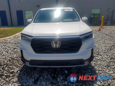 Piąte zdjęcie samochodu w środku: 2025 HONDA PILOT TOURING VIN:5FNYG1H70SB176881 - miniatura