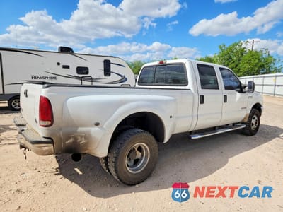 Trzecie zdjęcie samochodu z tyłu: 2002 FORD F350 SUPER DUTY VIN:1FTWW33F32EC74731 - miniatura