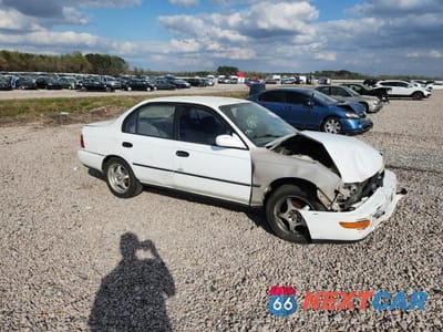 Czwarte zdjęcie samochodu z boku: 1995 TOYOTA COROLLA DX VIN:1NXAE09B7SZ316433 - miniatura