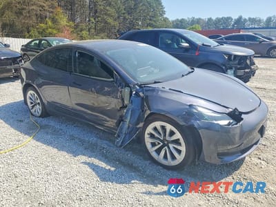 Czwarte zdjęcie samochodu z boku: 2023 TESLA MODEL 3 VIN:5YJ3E1EB8PF479052 - miniatura