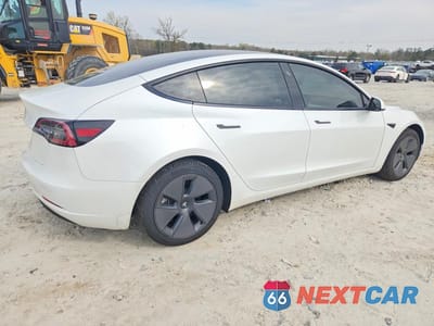 Trzecie zdjęcie samochodu z tyłu: 2023 TESLA MODEL 3 VIN:5YJ3E1EA5PF422993 - miniatura