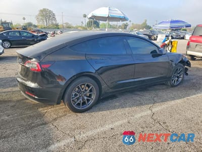 Trzecie zdjęcie samochodu z tyłu: 2023 TESLA MODEL 3 VIN:5YJ3E1EA0PF493857 - miniatura