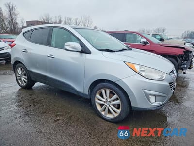Czwarte zdjęcie samochodu z boku: 2011 HYUNDAI TUCSON LIMITED VIN:KM8JU3AC6BU259571 - miniatura