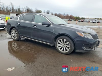Czwarte zdjęcie samochodu z boku: 2015 LINCOLN MKS VIN:1LNHL9EK9FG601735 - miniatura