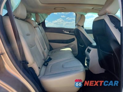 Zdjęcie 11 z 13 samochodu: 2021 FORD EDGE TITANIUM VIN:2FMPK4K91MBA21094 - miniatura