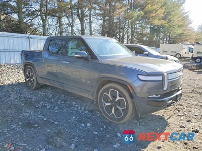Czwarte zdjęcie samochodu z boku: 2023 RIVIAN R1T ADVENTURE VIN:7FCTGAAA1PN023638 - miniatura