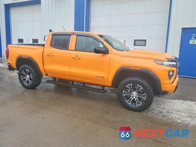 Czwarte zdjęcie samochodu z boku: 2025 GMC CANYON AT4 VIN:1GTP2DEK3S1220210 - miniatura