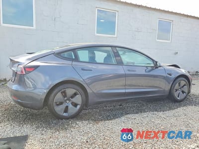 Trzecie zdjęcie samochodu z tyłu: 2022 TESLA MODEL 3 VIN:5YJ3E1EB1NF260883 - miniatura