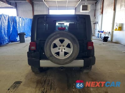 Zdjęcie 6 z 11 samochodu: 2011 JEEP WRANGLER SAHARA VIN:1J4AA5D12BL538454 - miniatura