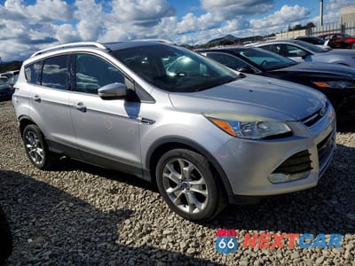 Czwarte zdjęcie samochodu z boku: 2014 FORD ESCAPE TITANIUM VIN:1FMCU9J90EUD26377 - miniatura