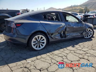 Trzecie zdjęcie samochodu z tyłu: 2022 TESLA MODEL 3 VIN:5YJ3E1EA1NF371487 - miniatura