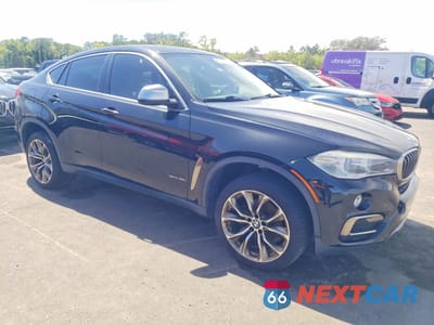 Czwarte zdjęcie samochodu z boku: 2018 BMW X6 SDRIVE35I VIN:5UXKU0C58J0G69527 - miniatura