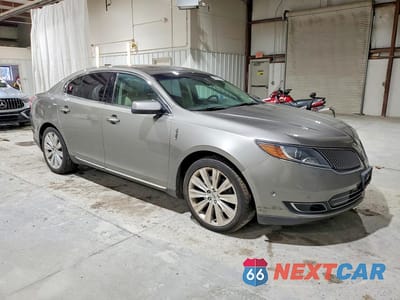 Czwarte zdjęcie samochodu z boku: 2015 LINCOLN MKS VIN:1LNHL9FT6FG607757 - miniatura