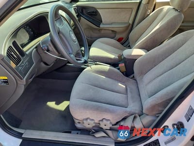 Zdjęcie 7 z 12 samochodu: 2004 HYUNDAI ELANTRA GLS VIN:KMHDN46D14U797972 - miniatura