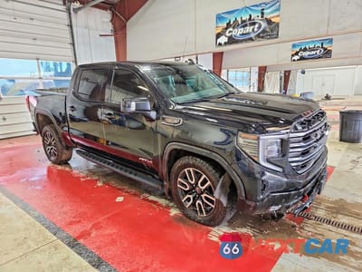 Czwarte zdjęcie samochodu z boku: 2022 GMC SIERRA K1500 AT4 VIN:1GTPUEEL4NZ551067 - miniatura