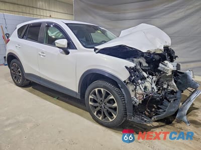 Czwarte zdjęcie samochodu z boku: 2016 MAZDA CX-5 GT VIN:JM3KE4DY1G0670014 - miniatura