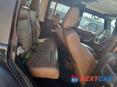 Zdjęcie 10 z 12 samochodu: 2011 JEEP WRANGLER UNLIMITED RUBICON VIN:1J4HA6H13BL585863 - miniatura