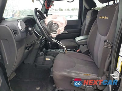 Zdjęcie 7 z 12 samochodu: 2014 JEEP WRANGLER UNLIMITED SAHARA VIN:1C4BJWEG5EL140629 - miniatura