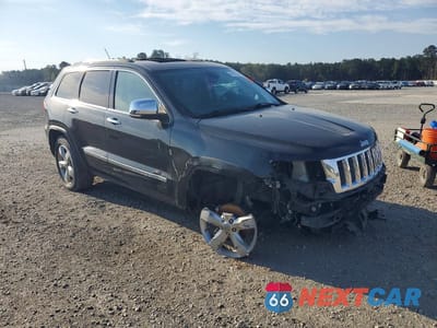 Czwarte zdjęcie samochodu z boku: 2013 JEEP GRAND CHEROKEE OVERLAND VIN:1C4RJECG9DC526108 - miniatura