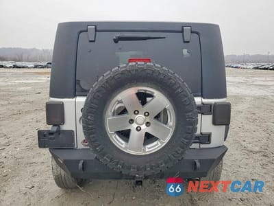 Zdjęcie 6 z 11 samochodu: 2010 JEEP WRANGLER UNLIMITED SAHARA VIN:1J4BA5H16AL101702 - miniatura