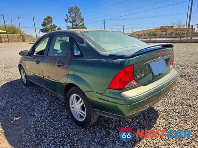 Trzecie zdjęcie samochodu z tyłu: 2000 FORD FOCUS SE VIN:1FAFP3433YW219500 - miniatura