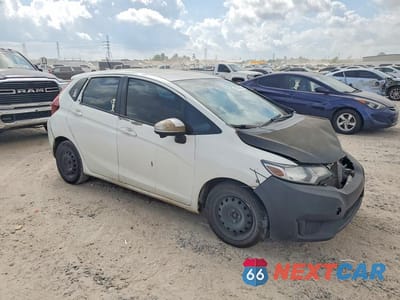 Czwarte zdjęcie samochodu z boku: 2017 HONDA FIT LX VIN:3HGGK5H50HM705686 - miniatura