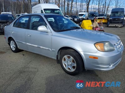 Czwarte zdjęcie samochodu z boku: 2005 HYUNDAI ACCENT GLS VIN:KMHCG45CX5U598645 - miniatura