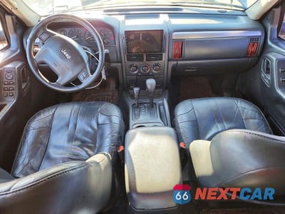 Zdjęcie 8 z 13 samochodu: 2002 JEEP GRAND CHEROKEE SPORT VIN:1J8GW38S42C236293 - miniatura