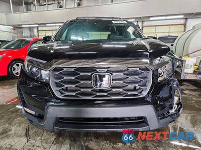 Piąte zdjęcie samochodu w środku: 2023 HONDA PASSPORT EXL VIN:5FNYF8H5XPB008070 - miniatura