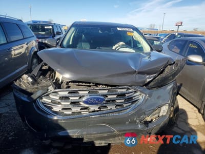 Piąte zdjęcie samochodu w środku: 2021 FORD EDGE TITANIUM VIN:2FMPK3K90MBA18083 - miniatura
