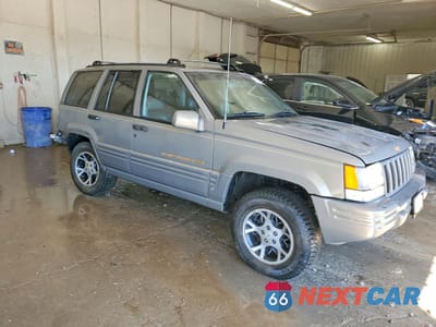 Czwarte zdjęcie samochodu z boku: 1996 JEEP GRAND CHEROKEE LIMITED VIN:1J4EZ78Y8TC149185 - miniatura