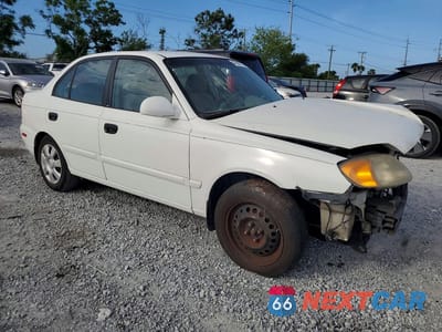 Czwarte zdjęcie samochodu z boku: 2005 HYUNDAI ACCENT GLS VIN:KMHCG45C55U594308 - miniatura