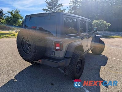 Czwarte zdjęcie samochodu z boku: 2023 JEEP WRANGLER 4XE VIN:1C4JJXN64PW646446 - miniatura