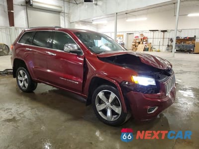 Czwarte zdjęcie samochodu z boku: 2016 JEEP GRAND CHEROKEE OVERLAND VIN:1C4RJFCT9GC453748 - miniatura
