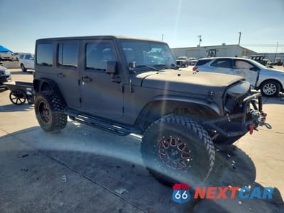 Czwarte zdjęcie samochodu z boku: 2013 JEEP WRANGLER UNLIMITED SPORT VIN:1C4BJWDG1DL659144 - miniatura