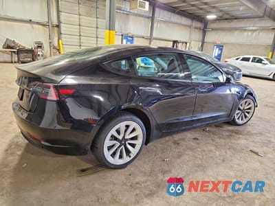Trzecie zdjęcie samochodu z tyłu: 2023 TESLA MODEL 3 VIN:5YJ3E1EA3PF431062 - miniatura