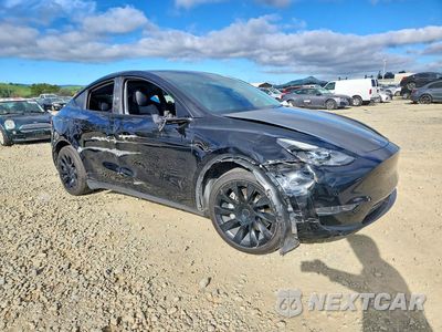 Czwarte zdjęcie samochodu z boku: 2021 TESLA MODEL Y VIN:5YJYGDEE2MF253273 - miniatura
